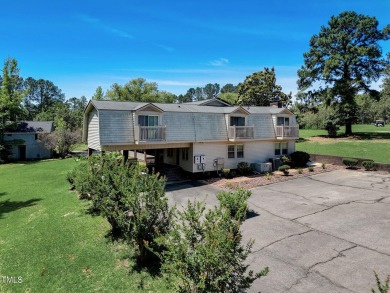 This home offers a unique layout and plenty of potential for on Carolina Trace Country Club in North Carolina - for sale on GolfHomes.com, golf home, golf lot