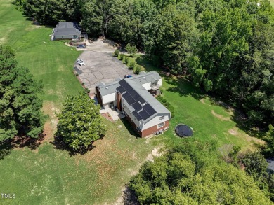 This home offers a unique layout and plenty of potential for on Carolina Trace Country Club in North Carolina - for sale on GolfHomes.com, golf home, golf lot