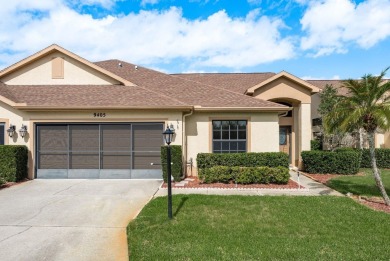 This villa is located inside the guarded gate of Timber Greens on Timber Greens Country Club in Florida - for sale on GolfHomes.com, golf home, golf lot