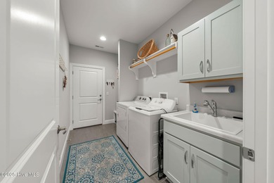 This beautiful coastal home located in St. James Plantation is on Members Club At St. James Plantation in North Carolina - for sale on GolfHomes.com, golf home, golf lot