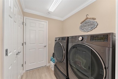 NO BOND! NEW ROOF! NEW A/C! GOLF CART GARAGE! NEUTRAL FRESH on Egret Championship Golf Course in Florida - for sale on GolfHomes.com, golf home, golf lot