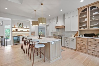 This gorgeous complete remodel by Evan Talan homes shows like a on Loch Lloyd Country Club in Missouri - for sale on GolfHomes.com, golf home, golf lot