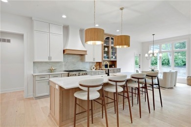 This gorgeous complete remodel by Evan Talan homes shows like a on Loch Lloyd Country Club in Missouri - for sale on GolfHomes.com, golf home, golf lot