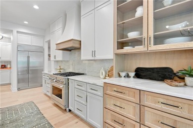 This gorgeous complete remodel by Evan Talan homes shows like a on Loch Lloyd Country Club in Missouri - for sale on GolfHomes.com, golf home, golf lot