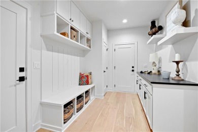 This gorgeous complete remodel by Evan Talan homes shows like a on Loch Lloyd Country Club in Missouri - for sale on GolfHomes.com, golf home, golf lot