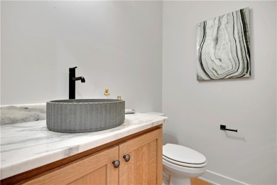 This gorgeous complete remodel by Evan Talan homes shows like a on Loch Lloyd Country Club in Missouri - for sale on GolfHomes.com, golf home, golf lot