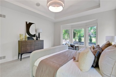 This gorgeous complete remodel by Evan Talan homes shows like a on Loch Lloyd Country Club in Missouri - for sale on GolfHomes.com, golf home, golf lot
