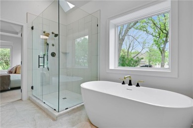 This gorgeous complete remodel by Evan Talan homes shows like a on Loch Lloyd Country Club in Missouri - for sale on GolfHomes.com, golf home, golf lot