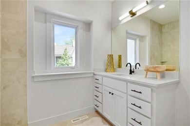 This gorgeous complete remodel by Evan Talan homes shows like a on Loch Lloyd Country Club in Missouri - for sale on GolfHomes.com, golf home, golf lot