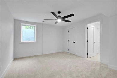 This gorgeous complete remodel by Evan Talan homes shows like a on Loch Lloyd Country Club in Missouri - for sale on GolfHomes.com, golf home, golf lot