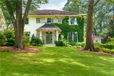 Two stately oaks frame this picturesque home on top of a gentle on Bobby Jones Golf Club in Georgia - for sale on GolfHomes.com, golf home, golf lot