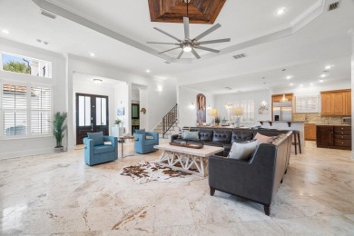 This exquisite custom home, nestled in the secure and golf on Regatta Bay Golf and Country Club in Florida - for sale on GolfHomes.com, golf home, golf lot