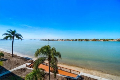 Under contract-accepting backup offers. WATERFRONT LIVING WITH on Isla Del Sol Yacht and Country Club in Florida - for sale on GolfHomes.com, golf home, golf lot