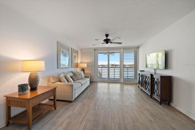 Under contract-accepting backup offers. WATERFRONT LIVING WITH on Isla Del Sol Yacht and Country Club in Florida - for sale on GolfHomes.com, golf home, golf lot