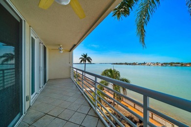 Under contract-accepting backup offers. WATERFRONT LIVING WITH on Isla Del Sol Yacht and Country Club in Florida - for sale on GolfHomes.com, golf home, golf lot