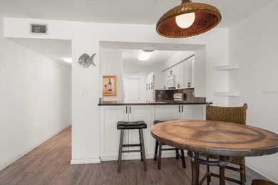 Under contract-accepting backup offers. WATERFRONT LIVING WITH on Isla Del Sol Yacht and Country Club in Florida - for sale on GolfHomes.com, golf home, golf lot