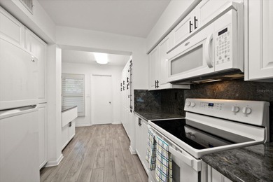 Under contract-accepting backup offers. WATERFRONT LIVING WITH on Isla Del Sol Yacht and Country Club in Florida - for sale on GolfHomes.com, golf home, golf lot