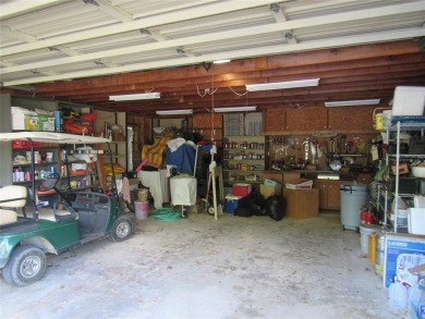 GOLF CART IN GARAGE AND BOAT SLIP IN PRIVATE BOATHOUSE WITH on Tanglewood Resort in Texas - for sale on GolfHomes.com, golf home, golf lot
