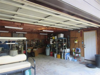 GOLF CART IN GARAGE AND BOAT SLIP IN PRIVATE BOATHOUSE WITH on Tanglewood Resort in Texas - for sale on GolfHomes.com, golf home, golf lot