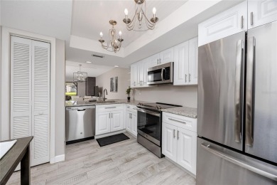 Stunning Waterview Condo in the Gated Community of East Lake on East Lake Woodlands Country Club in Florida - for sale on GolfHomes.com, golf home, golf lot