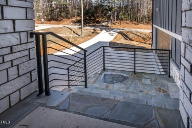 This modern custom-built home in Lake Royale is absolutely on River Golf and County Club at Lake Royale in North Carolina - for sale on GolfHomes.com, golf home, golf lot