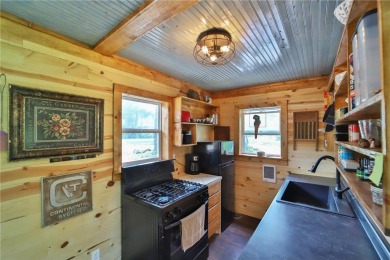 Enjoy the best of the Northwoods with this newly constructed on Hardwoods Golf Club At Mille Lacs in Minnesota - for sale on GolfHomes.com, golf home, golf lot