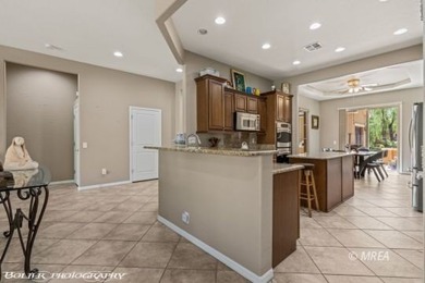 Set on nearly a quarter-acre premium golf course lot within Sun on Conestoga Golf Club in Nevada - for sale on GolfHomes.com, golf home, golf lot