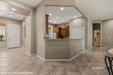 Set on nearly a quarter-acre premium golf course lot within Sun on Conestoga Golf Club in Nevada - for sale on GolfHomes.com, golf home, golf lot