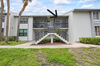This second floor corner unit is in a gated community on Feather Sound Country Club in Florida - for sale on GolfHomes.com, golf home, golf lot