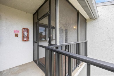 This second floor corner unit is in a gated community on Feather Sound Country Club in Florida - for sale on GolfHomes.com, golf home, golf lot