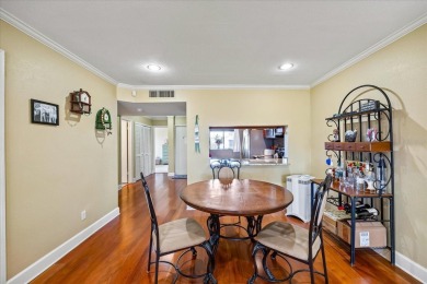 This second floor corner unit is in a gated community on Feather Sound Country Club in Florida - for sale on GolfHomes.com, golf home, golf lot