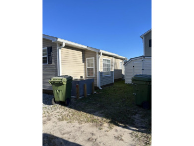 Bright  cheery 2BR/1BA beach cottage, 2024 ROOF  HVAC. Located on Prestwick Country Club in South Carolina - for sale on GolfHomes.com, golf home, golf lot