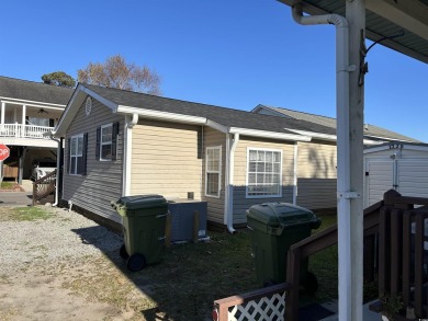 Bright  cheery 2BR/1BA beach cottage, 2024 ROOF  HVAC. Located on Prestwick Country Club in South Carolina - for sale on GolfHomes.com, golf home, golf lot