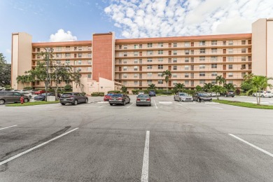 Spectacular lake views abound in this waterfront condominium on Marina Lakes Golf Course in Florida - for sale on GolfHomes.com, golf home, golf lot