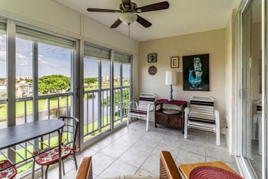 Spectacular lake views abound in this waterfront condominium on Marina Lakes Golf Course in Florida - for sale on GolfHomes.com, golf home, golf lot