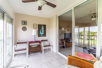 Spectacular lake views abound in this waterfront condominium on Marina Lakes Golf Course in Florida - for sale on GolfHomes.com, golf home, golf lot