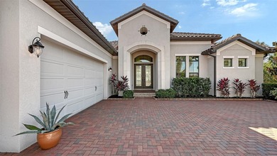 Set in Lakewood Ranch's Country Club East, this exceptional on Ritz-Carlton Members Golf Club in Florida - for sale on GolfHomes.com, golf home, golf lot