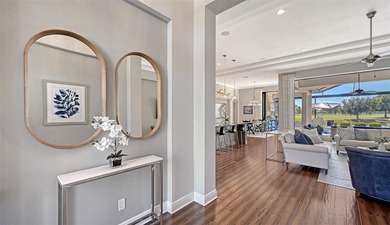 Set in Lakewood Ranch's Country Club East, this exceptional on Ritz-Carlton Members Golf Club in Florida - for sale on GolfHomes.com, golf home, golf lot