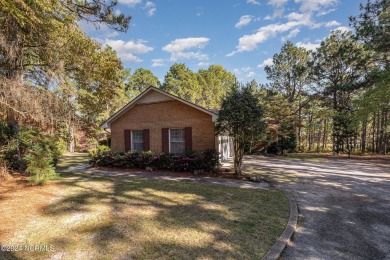 Welcome to this stunning brick home overlooking the 11th fairway on Whispering Pines Golf Course in North Carolina - for sale on GolfHomes.com, golf home, golf lot