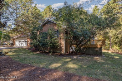 Welcome to this stunning brick home overlooking the 11th fairway on Whispering Pines Golf Course in North Carolina - for sale on GolfHomes.com, golf home, golf lot