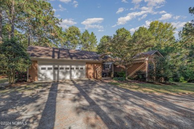 Welcome to this stunning brick home overlooking the 11th fairway on Whispering Pines Golf Course in North Carolina - for sale on GolfHomes.com, golf home, golf lot