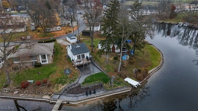 Experience the pinnacle of modern lakefront luxury. This on Turkeyfoot Lake Golf Links in Ohio - for sale on GolfHomes.com, golf home, golf lot