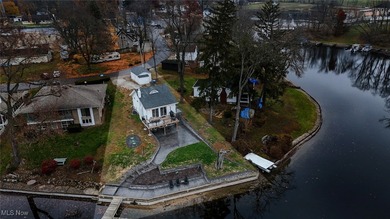 Experience the pinnacle of modern lakefront luxury. This on Turkeyfoot Lake Golf Links in Ohio - for sale on GolfHomes.com, golf home, golf lot