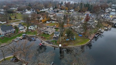 Experience the pinnacle of modern lakefront luxury. This on Turkeyfoot Lake Golf Links in Ohio - for sale on GolfHomes.com, golf home, golf lot