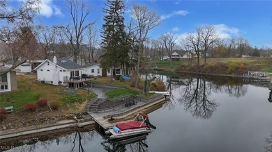 Experience the pinnacle of modern lakefront luxury. This on Turkeyfoot Lake Golf Links in Ohio - for sale on GolfHomes.com, golf home, golf lot
