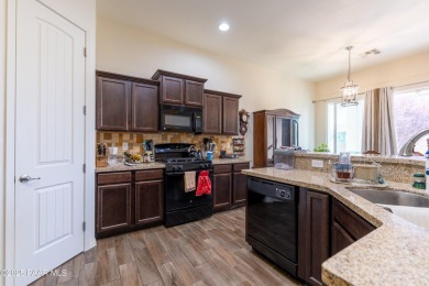 Nestled in Quailwood Meadows, this lovely & well-appointed on Quail Wood Greens Golf Course in Arizona - for sale on GolfHomes.com, golf home, golf lot