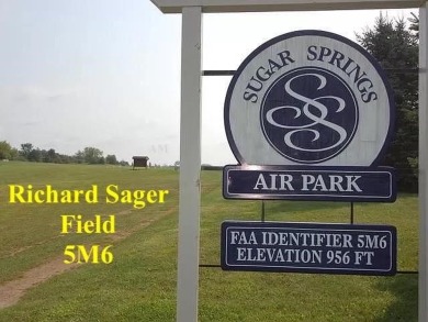 1/2 ACRE airpark lot with a taxiway to the runway, with sewer on Sugar Springs Country Club in Michigan - for sale on GolfHomes.com, golf home, golf lot