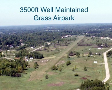 1/2 ACRE airpark lot with a taxiway to the runway, with sewer on Sugar Springs Country Club in Michigan - for sale on GolfHomes.com, golf home, golf lot