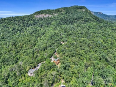 Classic log cabin, conveniently located behind the gates of on Rumbling Bald Resort on Lake Lure in North Carolina - for sale on GolfHomes.com, golf home, golf lot