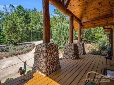 Classic log cabin, conveniently located behind the gates of on Rumbling Bald Resort on Lake Lure in North Carolina - for sale on GolfHomes.com, golf home, golf lot